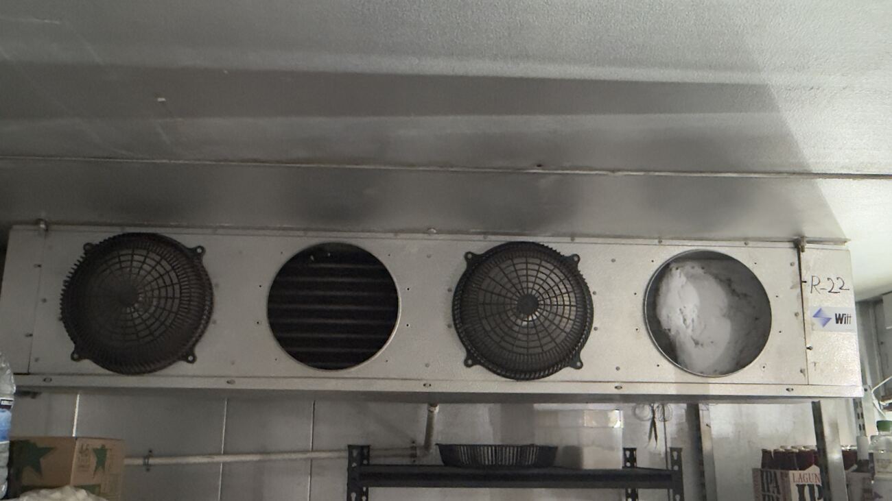 Walk-in cooler evaporator unit in a commercial store
